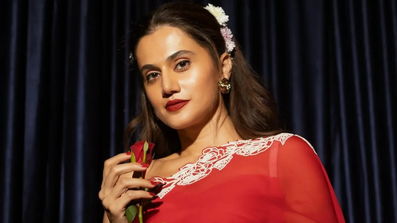 Drenched in crimson with a delicate white border, Taapsee served up fierce glamour. The deep red saree, a simple yet elegant white blouse, and cascading hair adorned with flowers screamed old-school romance with a new-age twist. Add bold red lips to the mix, and you’ve got Rani 2.0.