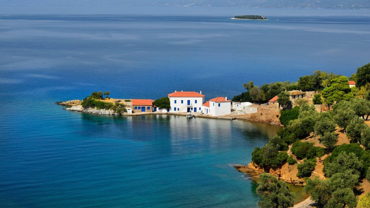 2. Pelion Peninsula – Where Trees Lean into the Sea The Pelion Peninsula, draped in oak and chestnut, feels less like a travel destination and more like a forgotten chapter from a myth. Between Athens and Thessaloniki, it curls like a sleeping creature, hiding stone villages such as Vizitsa and Portaria within its folds. Paths once trodden by centaurs descend through forests to remote beaches where the Aegean laps without ceremony. It is a place for wanderers, not tourists. (Image: Canva)