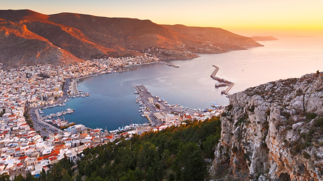 9. Kalymnos – The Island That Climbs Famed among climbers but known to few beyond that circle, Kalymnos is a Dodecanese island with sheer limestone cliffs, sponge-diving history, and a raw, rugged coastline. The villages here are stitched into the rock—Pothia with its harbor curve, and Chorio with its tangle of alleys. The island does not lend itself to spectacle. Instead, it offers challenge, and for those who rise to it, immense clarity. (Image: Canva)