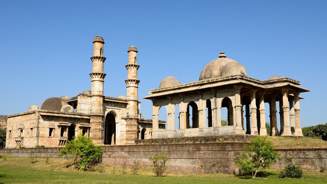 1. Champaner-Pavagadh Archaeological Park, Gujarat Once a strategic hilltop capital, this layered settlement blends Hindu ritualism with early Islamic architecture. Climb past 11th-century stepwells and mosque domes that predate the Mughals, all nestled beneath a volcanic bluff. (Image: Canva)