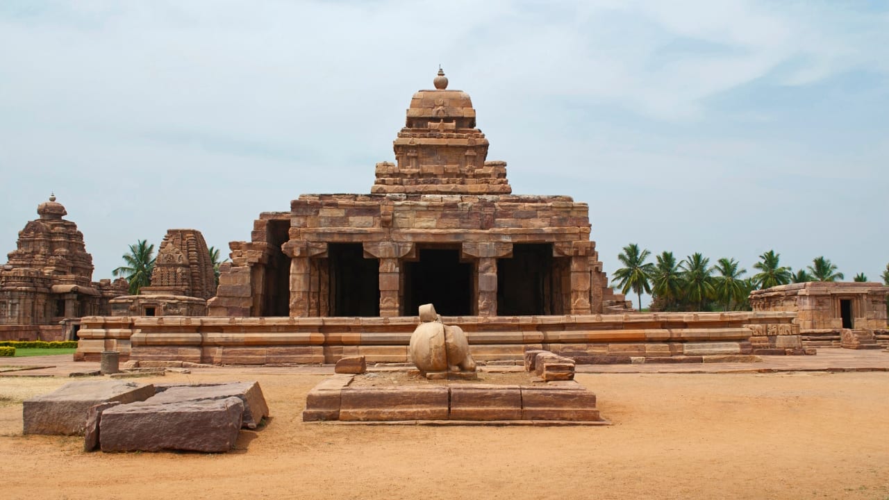 6. Pattadakal, Karnataka Once a coronation site along the Malaprabha River, a group of monuments at Pattadakal showcases a fusion of architectural styles. Its temples stand remarkably intact, each a quiet hymn to royal legacy. (Image: Canva)