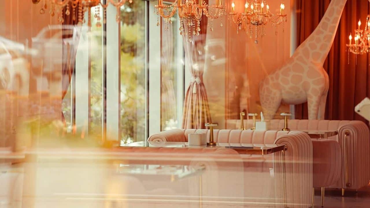 A giant pastel giraffe, crystal chandeliers, and plush blush seating make Kapil Sharma’s café feel like a scene out of a dream. It’s not just a dining spot—it’s an aesthetic experience. A giant pastel giraffe, crystal chandeliers, and plush blush seating make Kapil Sharma’s café feel like a scene out of a dream. It’s not just a dining spot—it’s an aesthetic experience.