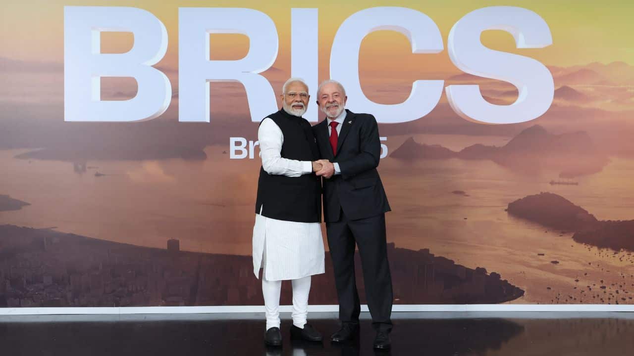 Prime Minister Narendra Modi received with a hug and handshake by Brazilian President Luiz Inácio Lula da Silva upon arrival at the 17th BRICS Summit. He called BRICS a &quot;powerful force for economic cooperation and global good&quot; as leaders gathered in Rio de Janeiro for summit talks. He also hailed the expansion of BRICS as proof of its adaptability, urging similar willpower for reforms in global institutions like the UN Security Council, WTO, and development banks. (Image: AFP)