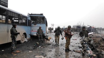 File photo of Indian soldiers examining the debris after an explosion in Kashmir's Pulwama district on February 14, 2019.