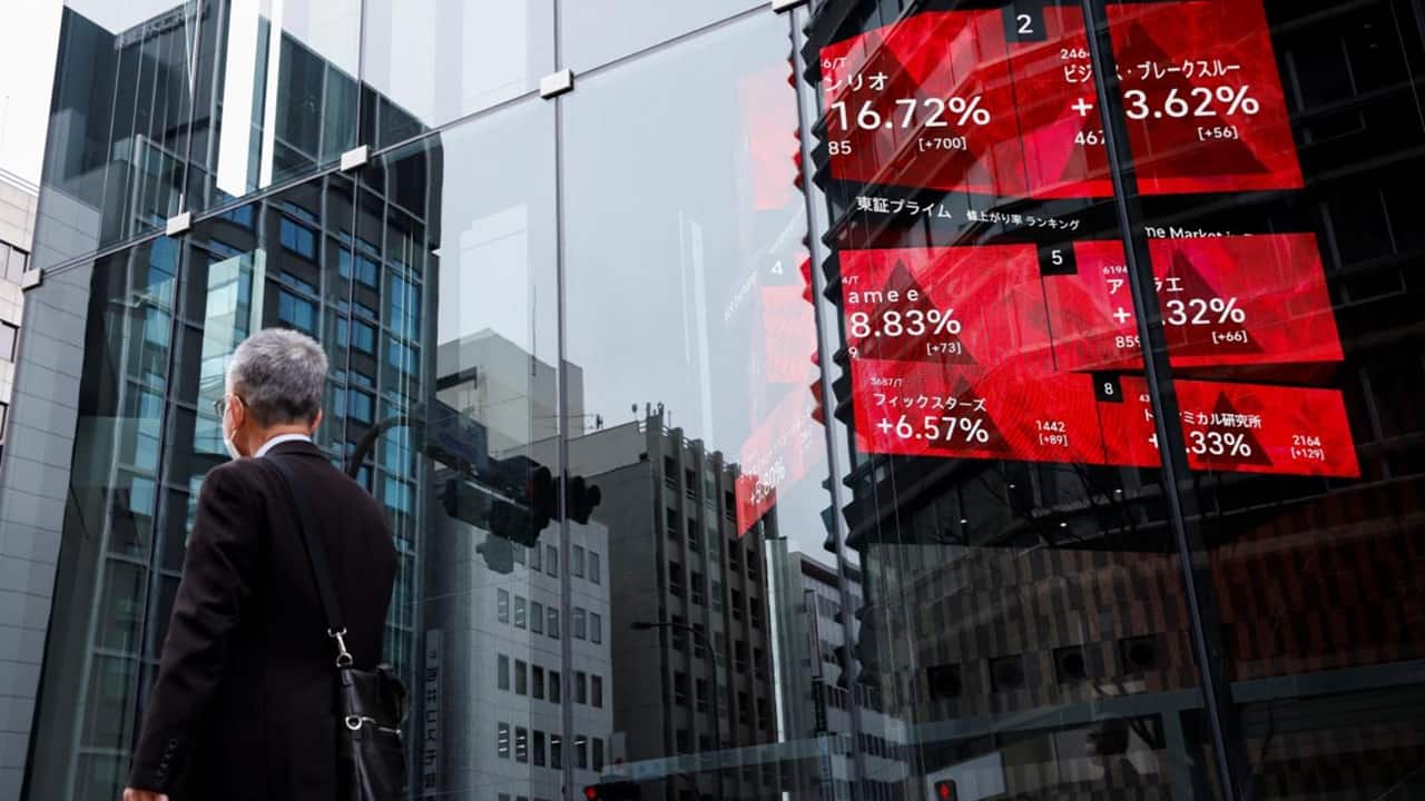 Asian stocks edge lower after mixed Fed signals
