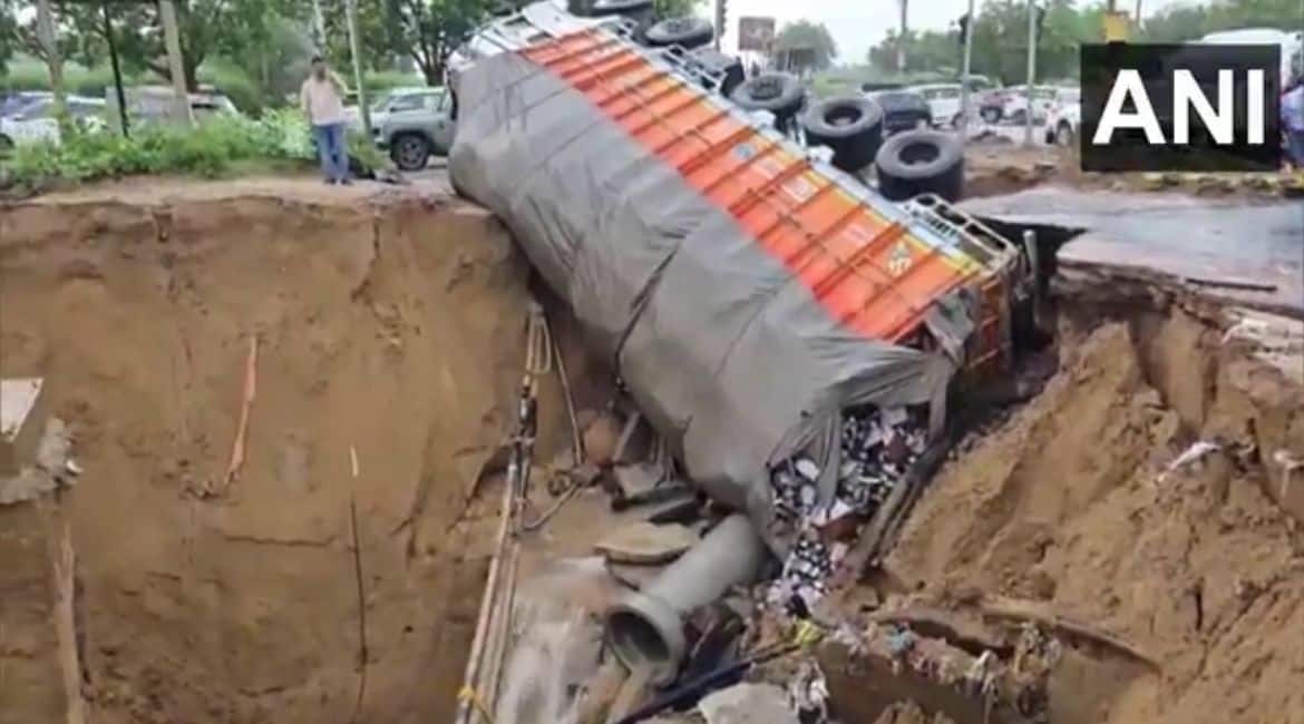 Beer truck sinks into Gurugram 'crater' as road caves in | Watch