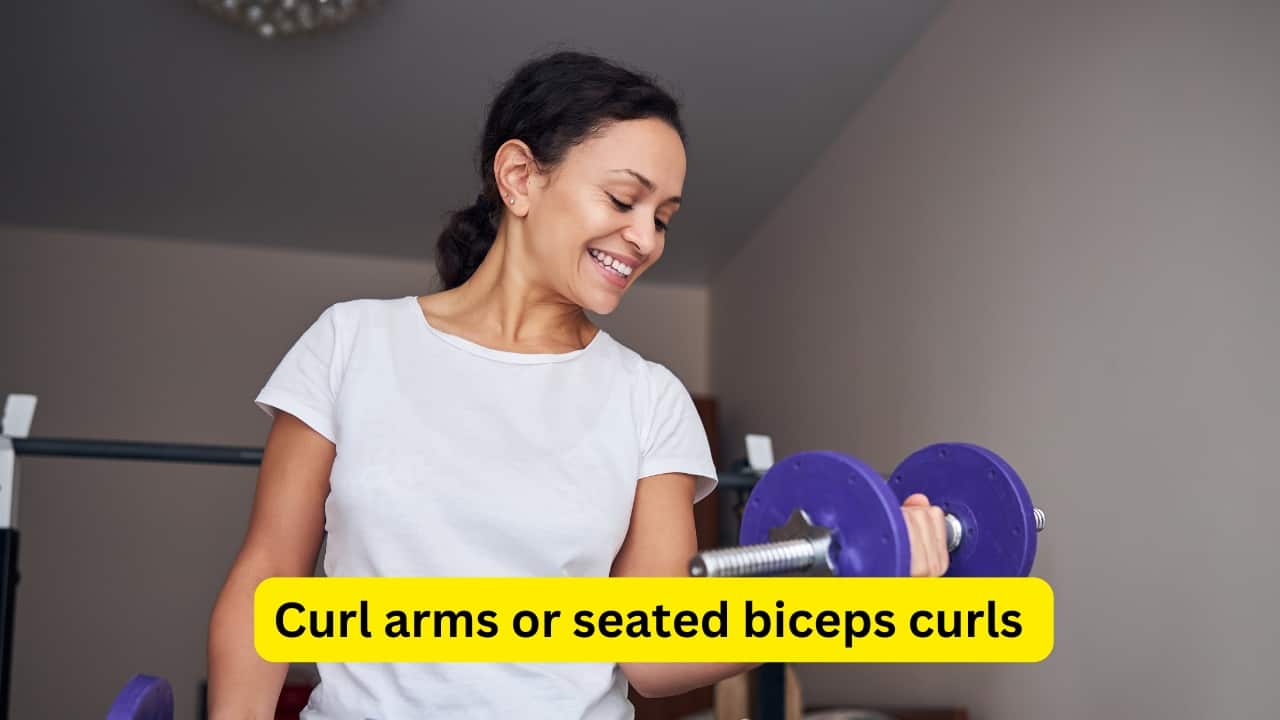 Curl arms or seated biceps curls Sit upright with feet flat and elbows by your sides. Bend elbows to lift hands towards shoulders, then lower them slowly. Do eight to fifteen repetitions, either one arm at a time or both. Progress by holding light weights like tins and eventually stand for full-body engagement and added difficulty.