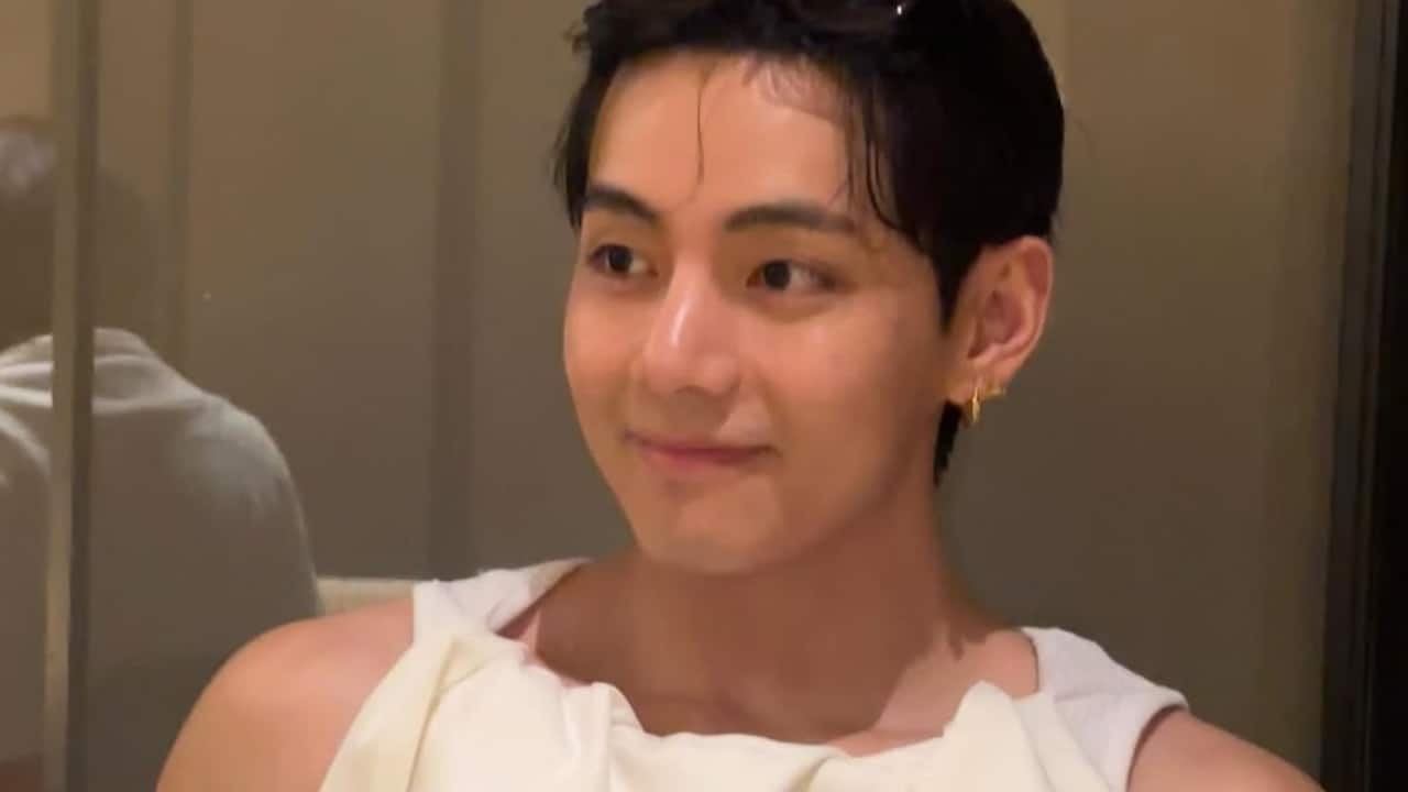 V in white Taehyung shared a photo on his Instagram sporting a white tank top, tucked with the same colored clothes. He looked cute as she flashed a sweet smile for the cameras.