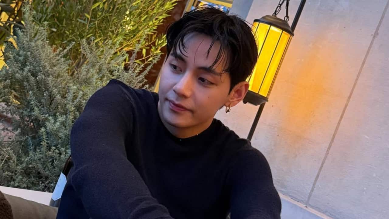 Dinner at Celine He sported a navy, fitted knit top that was tucked into tailored grey trousers for his dinner at Celine. The outfit was complemented with a silky scarf belt, which added flair to the look, and it quickly became one of the most talked-about ensembles from the trip.