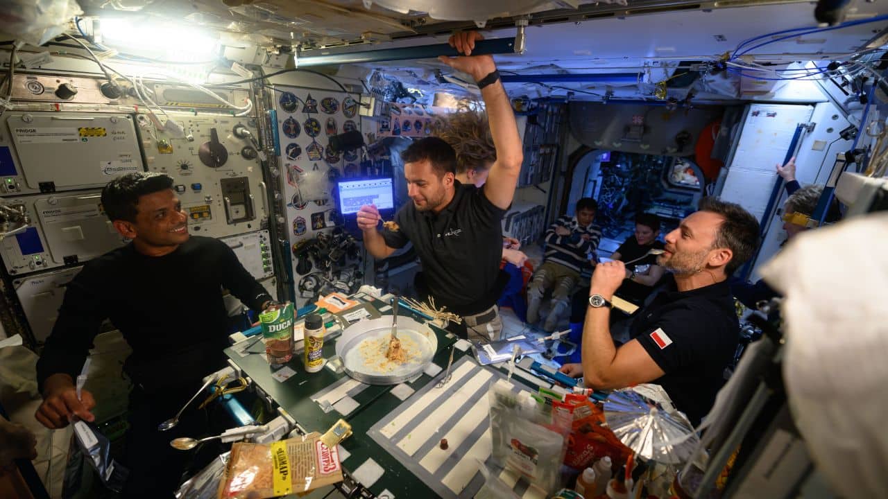 A Feast in Space Before Departure: Floating in zero gravity, Shukla and his fellow astronauts shared smiles and a meal as seen in newly released images from the space station. (Image: Axiom Space)