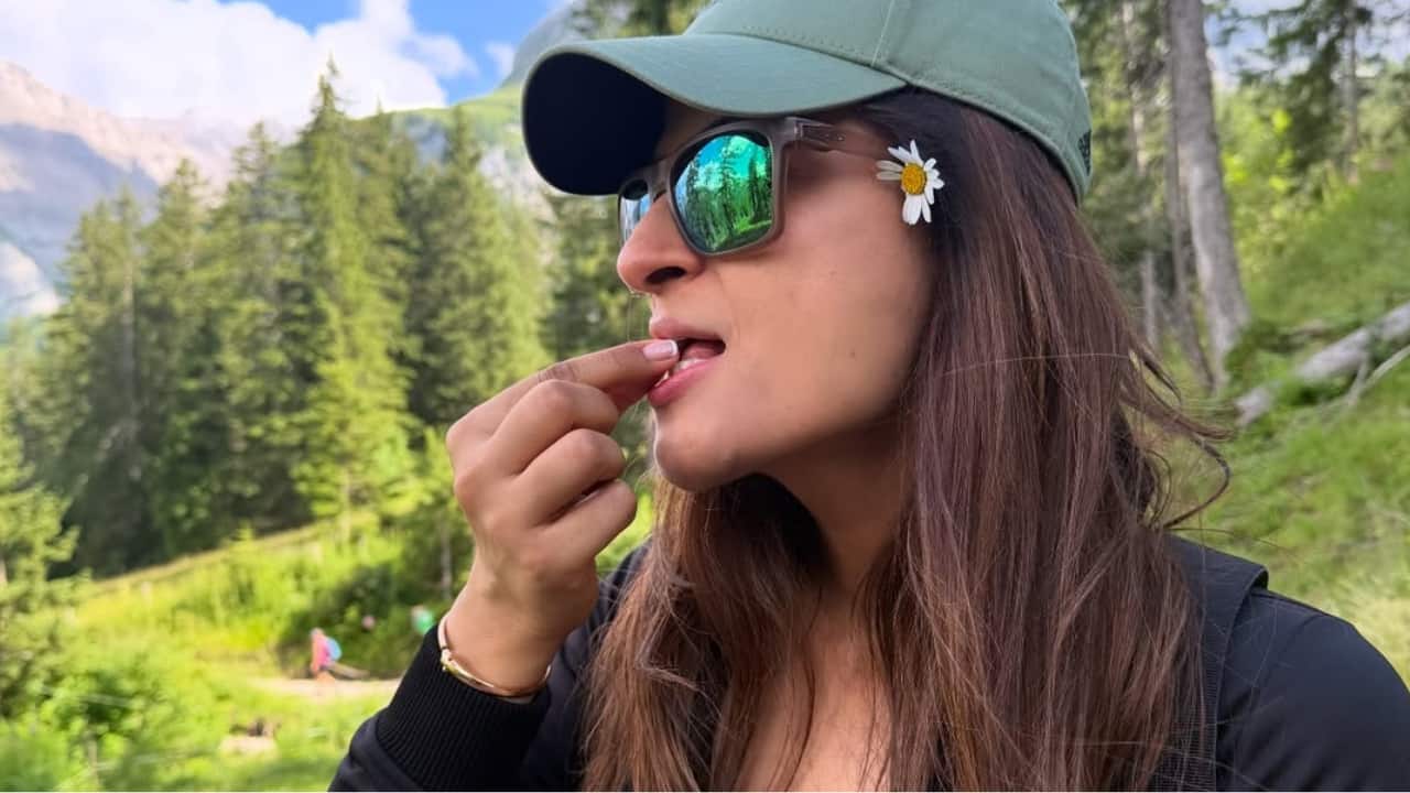 Berry break While exploring the mountain trails, Tahira picks fresh wild berries and tastes them with a smile. She captioned, ‘ The wild berries from the hike’. She also picked a small flower and tucked it in her ear. 