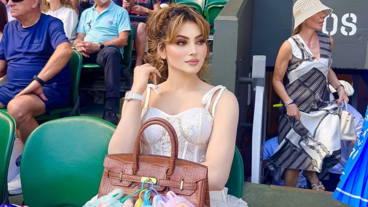 Elegant embellishments   The dress had a flared skirt with soft sequin embellishments, making it sparkle under the summer sun. The subtle shimmer added a touch of glamour to her sophisticated outfit.