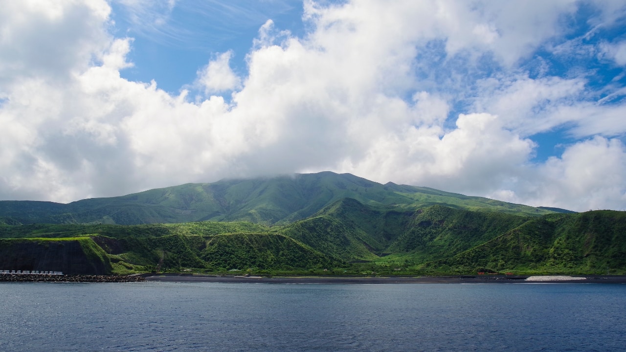 7. Miyakejima, Japan This volcanic island, located south of Tokyo, is no stranger to disruption. Following a major eruption in 2000, the island's remaining population must wear gas masks when sulfur dioxide levels spike. Permanent gas monitors dot the landscape, and emergency sirens serve as reminders that the island is anything but dormant. Yet, for many residents, Miyakejima remains home—albeit a fragile one. (Image: Canva) 7. Miyakejima, Japan This volcanic island, located south of Tokyo, is no stranger to disruption. Following a major eruption in 2000, the island's remaining population must wear gas masks when sulfur dioxide levels spike. Permanent gas monitors dot the landscape, and emergency sirens serve as reminders that the island is anything but dormant. Yet, for many residents, Miyakejima remains home—albeit a fragile one. (Image: Canva)