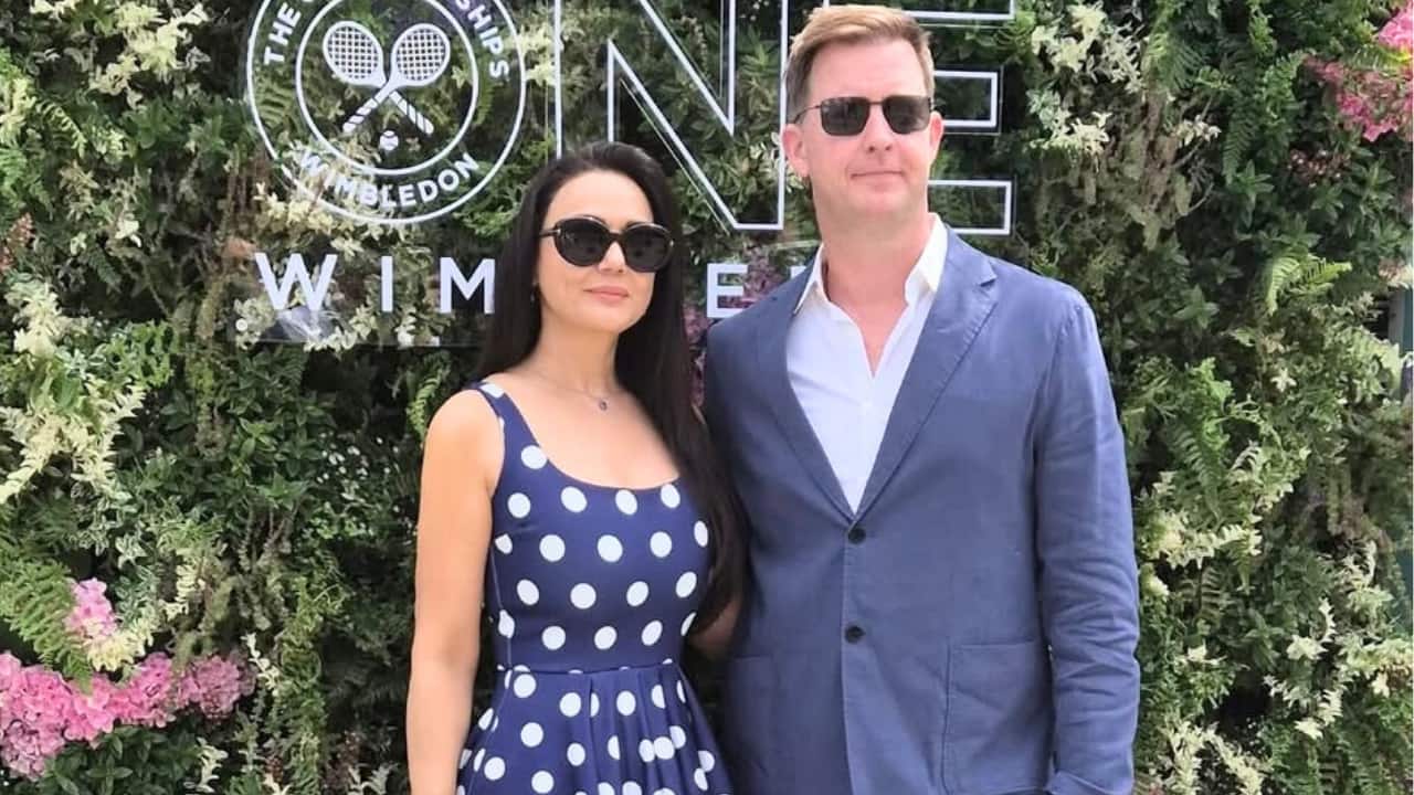 Preity Zinta Actress Preity Zinta graced the event with her ‘Pati Parmeshwar’ Gene Goodenough and enjoyed the Wimbledon final in London. Preity shared a series of photos from the match day. She donned a blue polka-dotted dress with off-white heels. Meanwhile, Gene complimented Preity in a blue suit. The actress also shared a video in which she was seen fanning herself to get respite from the heat.