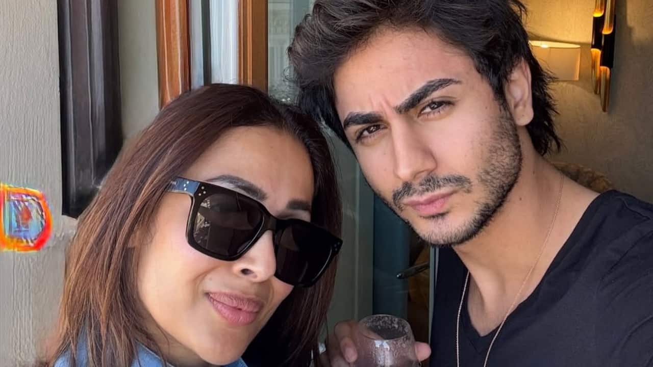 Mother-son time, powered by pink drinks - With sunglasses on and spirits high, they toast to new memories and laid-back days. 