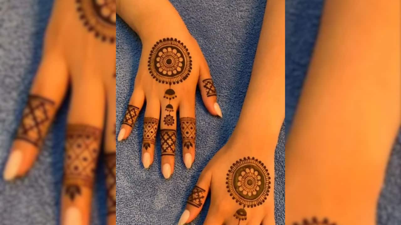 A round mandala in the center of the palm with delicate finger designs creates a traditional yet modern look. (image: Pinterest)