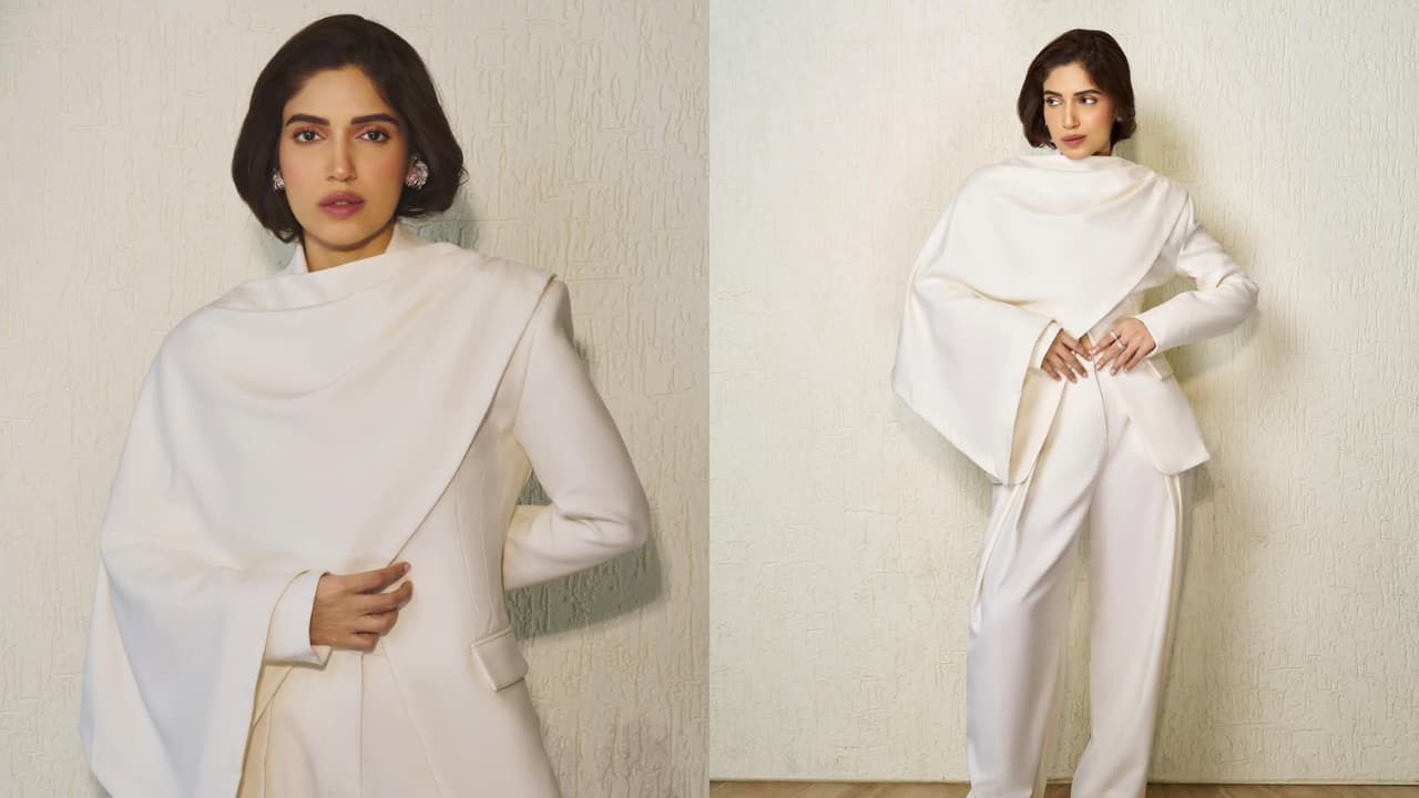 Bhumi Pednekar Bhumi’s swan-white pantsuit looks captivating for more reasons than one. Her suit features padded shoulders, clean lines, and oversized flared trousers. The show-stealing element, though, is the gorgeous pleated scarf.