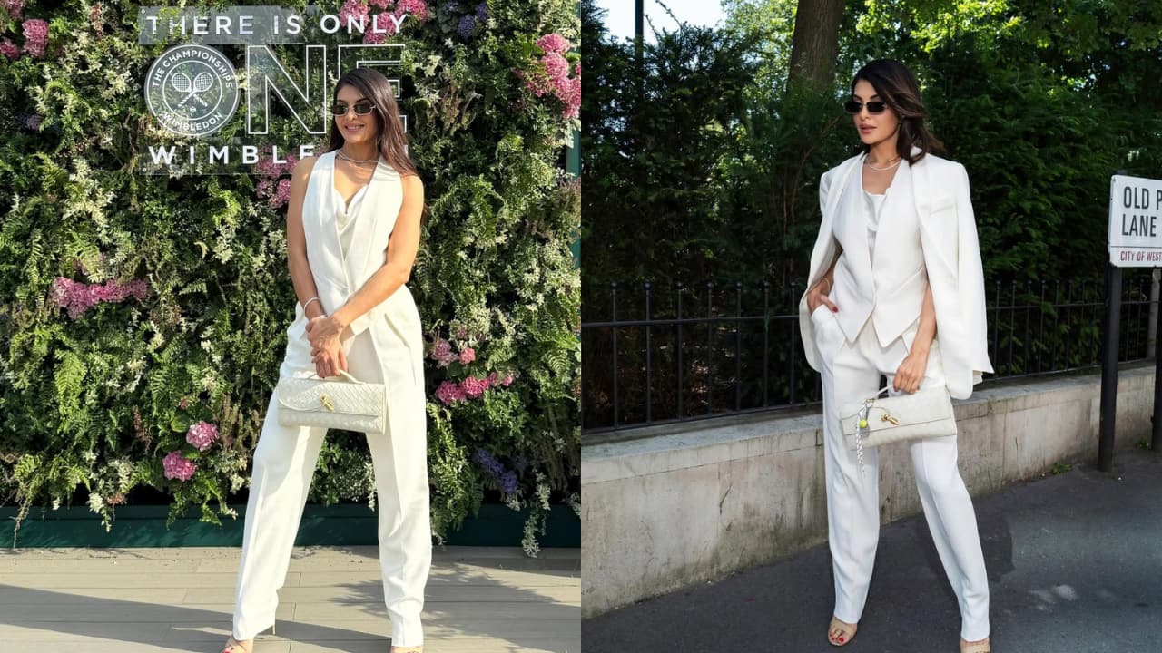 Jacqueline Fernandez Jacqueline made a stunning statement at Wimbledon in a white Giorgio Armani suit that was tailored to perfection. She carried a white Andiamo clutch with a tennis racket and ball keychain, which added a playful vibe to the look.