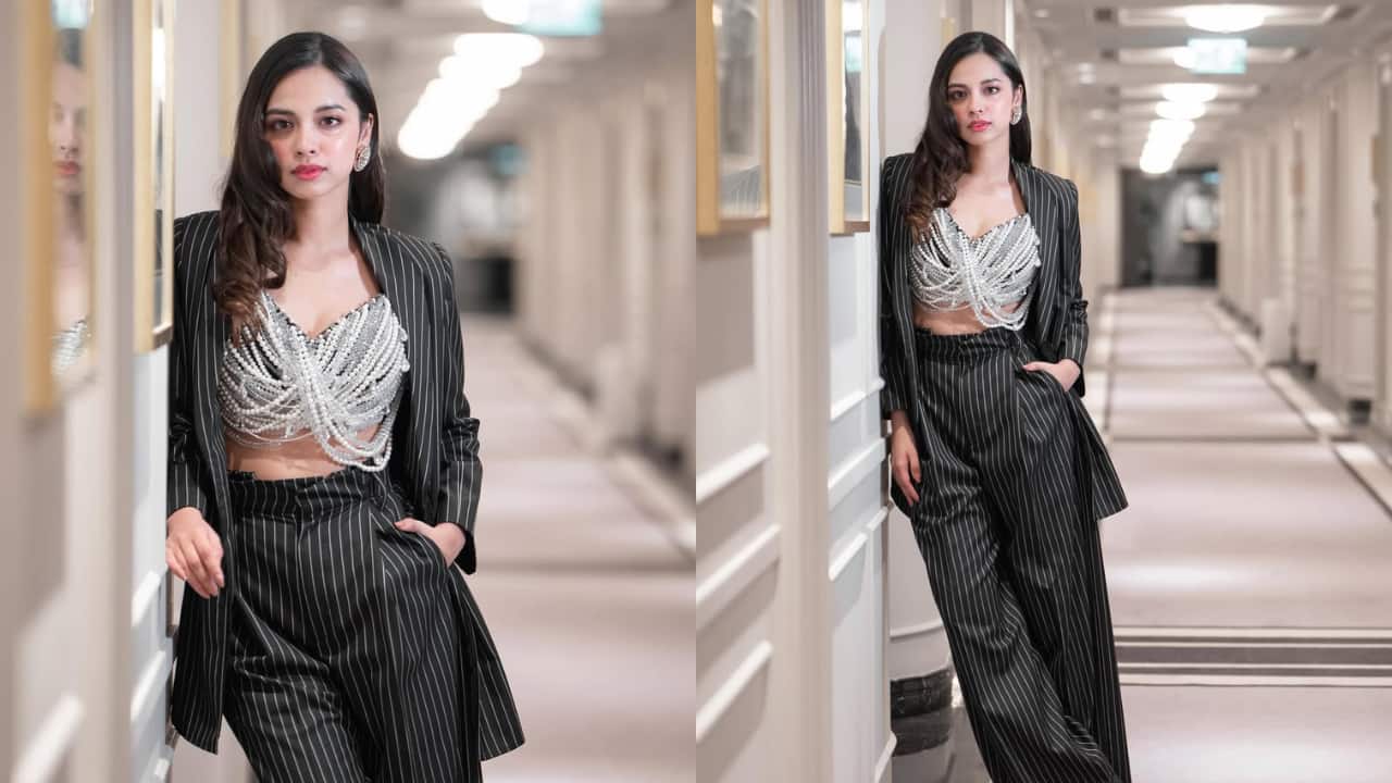 Nitanshi Goel Nitanshi redefines the pantsuit look by pairing her pinstriped, contemporary jacket and trousers with a beaded metallic top, making it more of a glamorous affair than a formal one. Unlike typical pantsuits, her silhouette is breezy, chic, and easy to slip into.