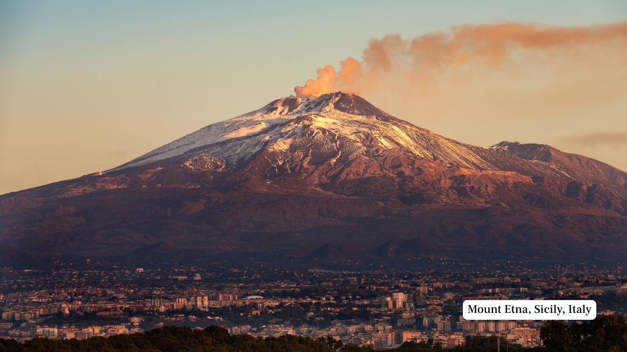 5. Mount Etna, Sicily, Italy – 3,357 m Europe’s most active volcano is in a constant state of change. Yet, Mount Etna remains accessible through authorised tours that adjust routes based on seismic activity. Trekkers cross alien landscapes of cooled lava, sulphur vents, and ancient craters—sometimes reaching the upper zones when conditions permit. (Image: Canva)