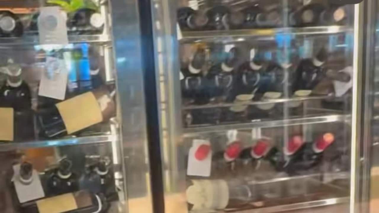 Vineyard Vibes – Rows of wine bottles in a glass cellar hinted at some indulgent wine tasting, a Tuscan classic. 