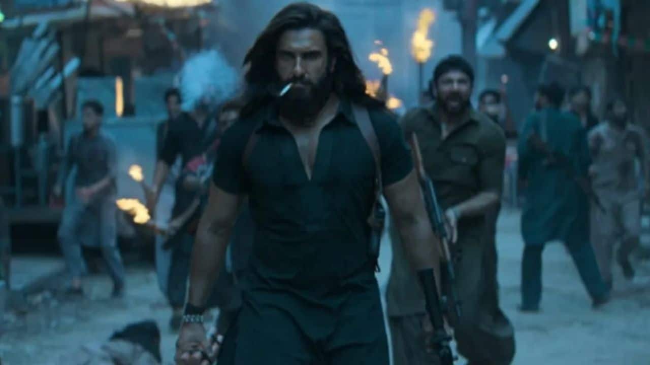 Ranveer Singh, who is well-known for his vigour and metamorphosis, is supposedly playing a strong Macho Man in the high-profile, pan-India action drama Dhurandhar. Despite the film's secrecy, the teaser and early images reveal a fierce Ranveer in an action-packed role that has never been seen before. Massive anticipation is already being generated by his physical transformation and the scope of the movie.