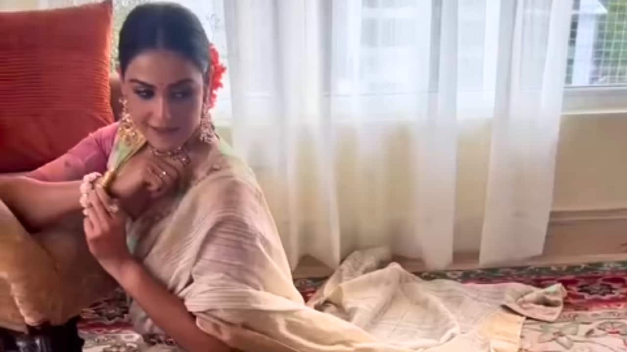 Vintage backdrop Genelia’s traditional look is enhanced by every element of the setting, including vintage candle stands and marigold blooms present in the room. The earthy tones and warm colours create a perfect backdrop for her to shine in timeless ethnic fashion. Vintage backdrop Genelia’s traditional look is enhanced by every element of the setting, including vintage candle stands and marigold blooms present in the room. The earthy tones and warm colours create a perfect backdrop for her to shine in timeless ethnic fashion.