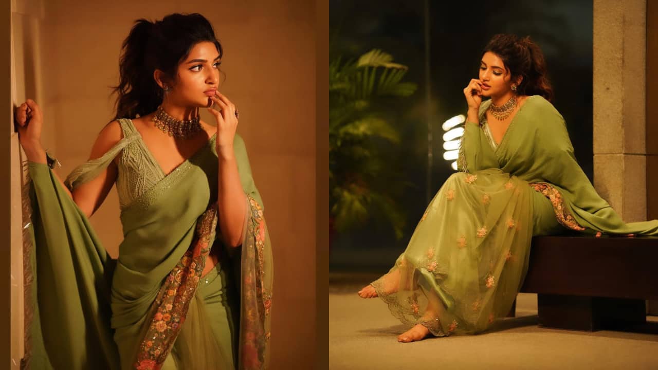 Sreeleela If you want a saree that has a bit of everything, Sreeleela’s drape is perfect. It is a stunning shade of green, adorned with a glittering floral pink border that enhances its celebratory feel. Her blouse with cold-shoulders makes for a great choice.