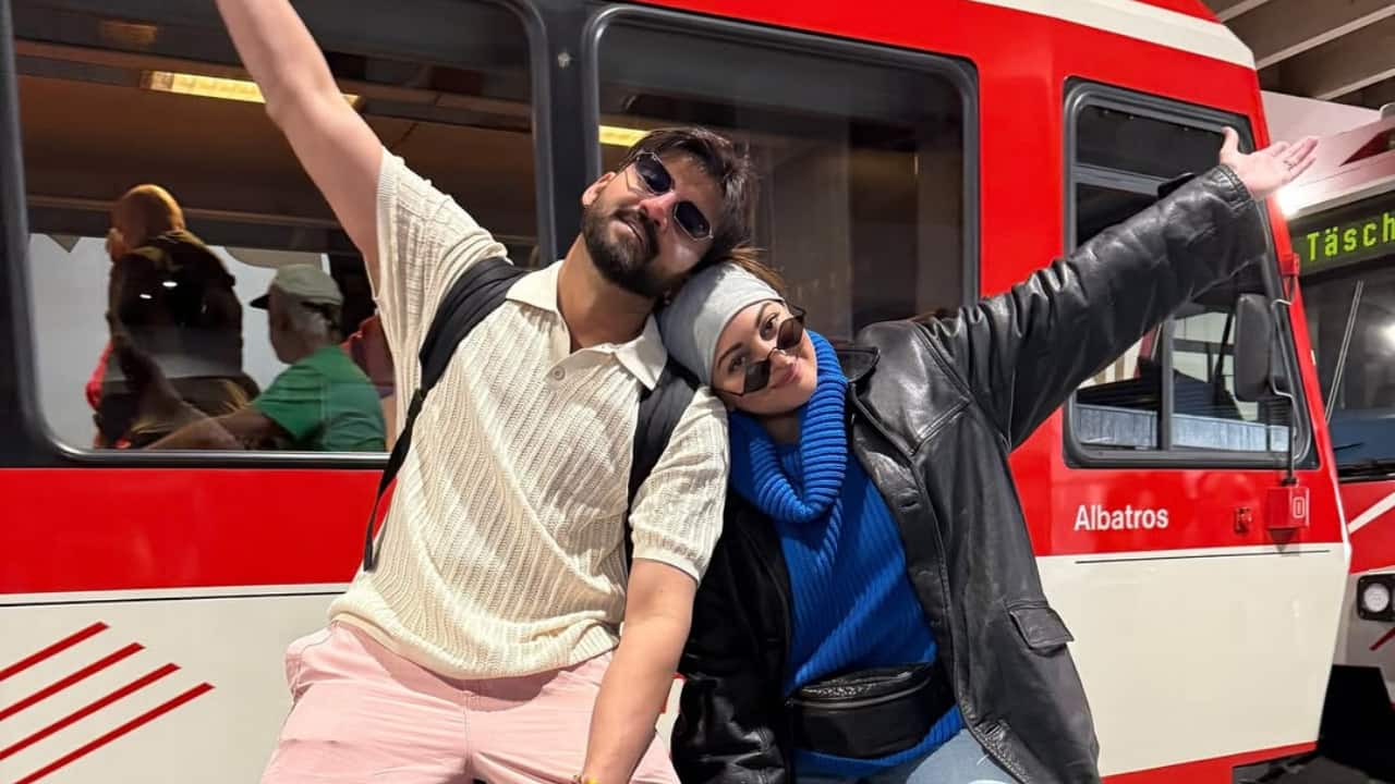 Platform poses, suitcase swag - Sitting on their luggage with arms wide open, they turned the station into a photo booth.