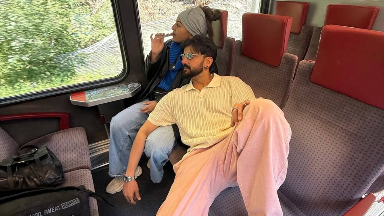 Window views and travel blues - Chilling on plush seats with forest views flying by, they looked straight out of a Euro trip film.