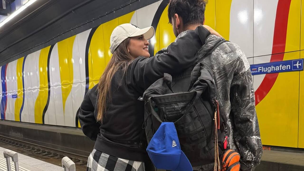 Late-night rides, tighter hugs - Under dim train lights and rows of suitcases, they held on tight—rom-com energy at its peak.