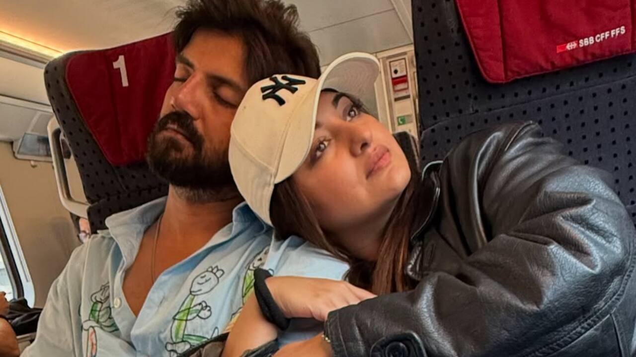 Goodbyes in motion blur - As a red Swiss train zoomed past, the couple waved it goodbye, wrapped in each other’s arms.