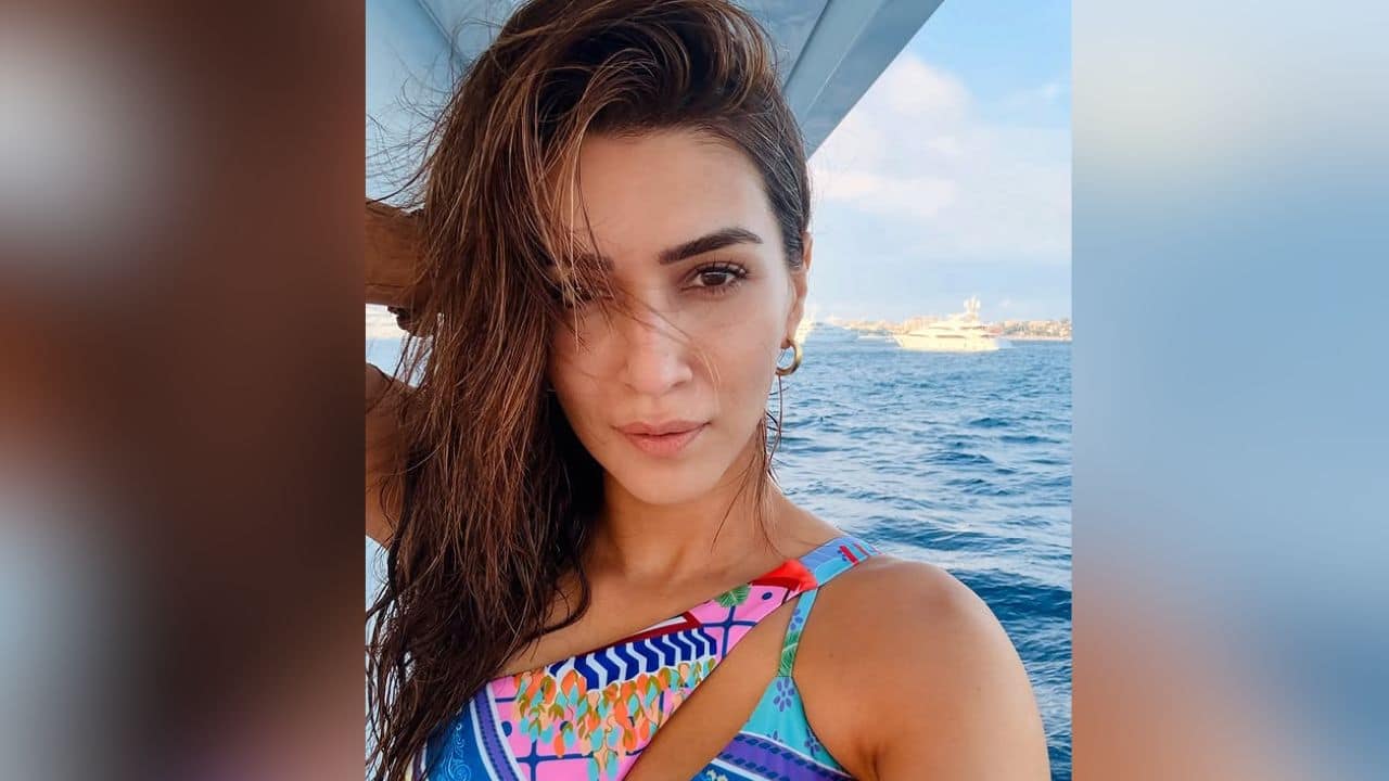 Kriti Sanon Kriti Sanon is seen in a close-up selfie, likely on a boat or near the sea, given the background. She is wearing a colorful, one-shoulder swimsuit or top with vibrant patterns and possibly abstract or geometric designs in shades of blue, pink, and orange. Kriti Sanon Kriti Sanon is seen in a close-up selfie, likely on a boat or near the sea, given the background. She is wearing a colorful, one-shoulder swimsuit or top with vibrant patterns and possibly abstract or geometric designs in shades of blue, pink, and orange.