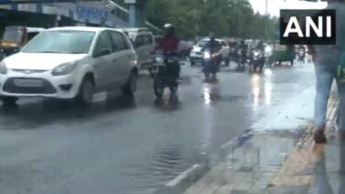 The showers led to a dip in temperature, offering relief to people discomforted by the humid conditions. (Photo: ANI)