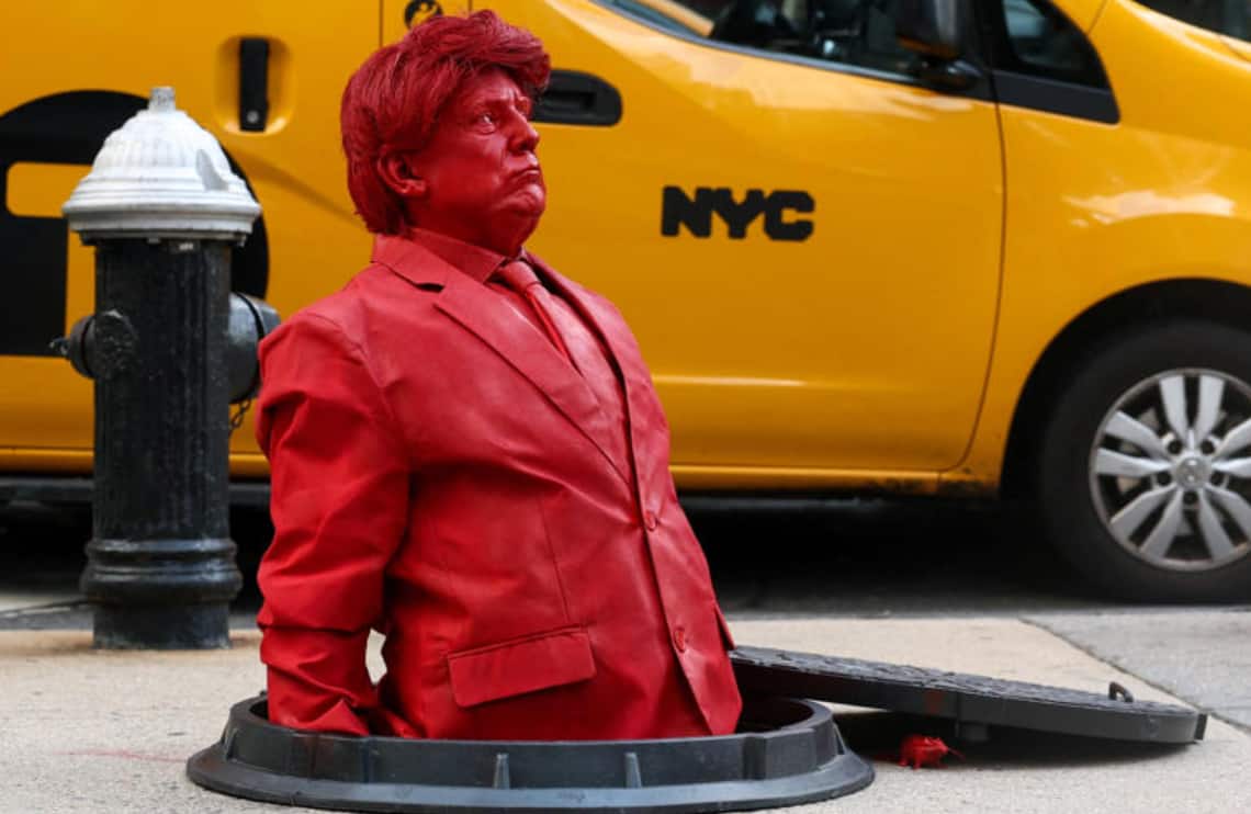 The life-size statue, created by French artist James Colomina, depicted Trump from the waist up in a suit and tie, rising from a sewer. (Image: Reuters) 