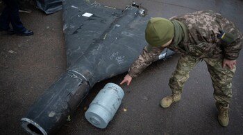 A Ukrainian officer shows a thermobaric charge from a downed Russian drone in a research laboratory in an undisclosed location in Ukraine on, Nov. 14, 2024.