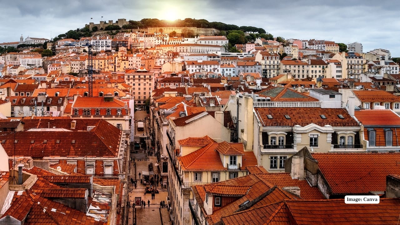 4. Lisbon, Portugal — A City of Timeless Charm and Coastal Splendor Lisbon enchants travelers with its historic neighborhoods, pastel-colored buildings, and soulful Fado music. Overlooking the Atlantic Ocean, the city blends old-world charm with modern vitality. From winding cobblestone streets to scenic viewpoints and nearby beaches, Lisbon offers rich cultural experiences framed by stunning coastal vistas. (Image: Canva)