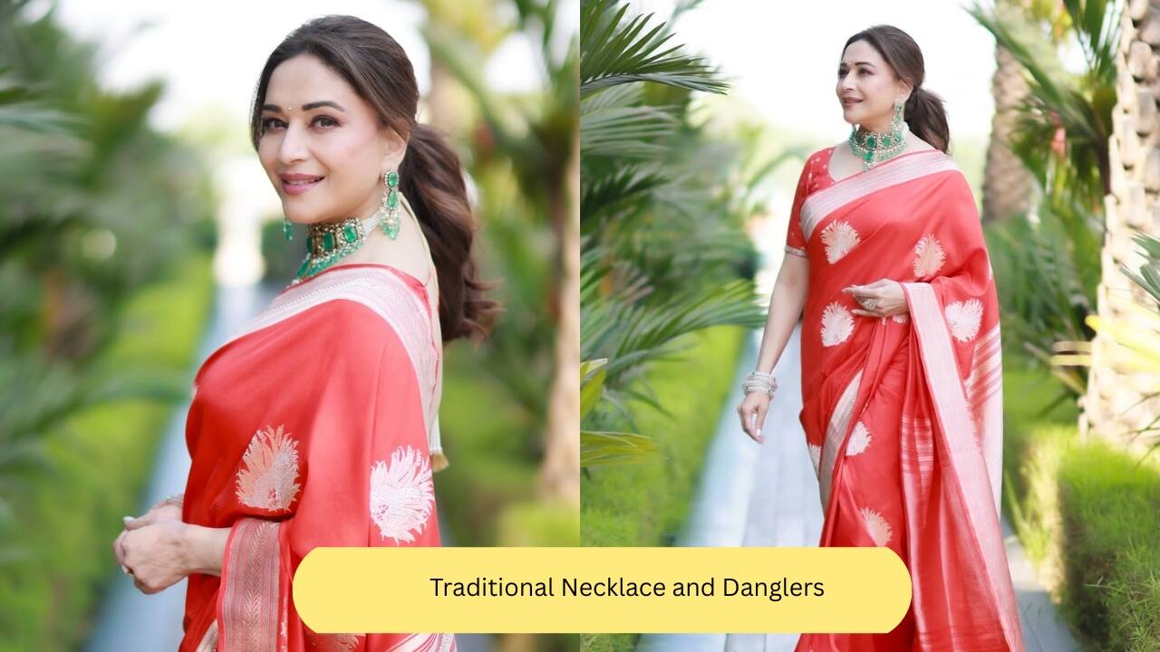Traditional Necklace and Danglers Red and green is a classic combination. Madhuri Dixit is a beauty in this desi red and gold saree elevated with emerald gemstones and pearls. The actress’s necklace is styled traditionally and paired with matching danglers.(Image: Instagram)