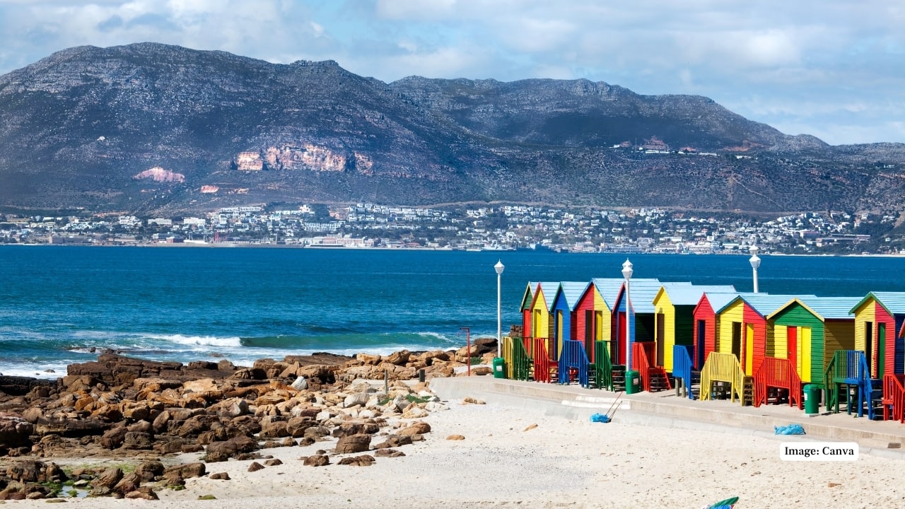 8. Muizenberg Beach, South Africa – 25 miles Located near Cape Town, Muizenberg Beach stretches for 25 miles and is famous for its colorful beach huts and excellent surfing conditions. It attracts both locals and tourists for swimming, surfing, and coastal walks. (Image: Canva)
