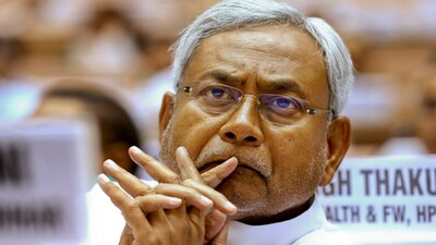 The controversy stems from a recent public function where Nitish Kumar was distributing appointment letters to newly recruited doctors. During the event, a video showed the Chief Minister gesturing towards a Muslim AYUSH doctor and briefly pulling down her hijab while handing over the letter. The clip drew widespread criticism on social media.