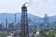 Oil prices hold steady as markets await Fed rate decision