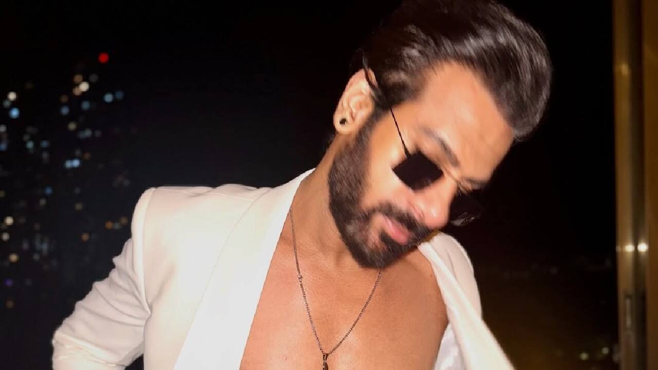 Accessories With micro sunglasses a chain as he flaunts his abs and looks dapper. Accessories With micro sunglasses a chain as he flaunts his abs and looks dapper.