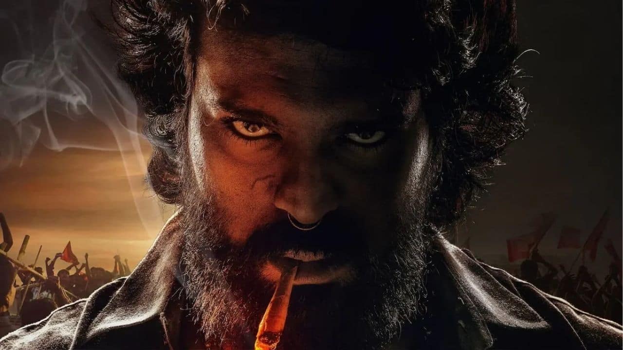 Ram Charan’s striking transformation for *Peddi* has grabbed attention—rugged beard, messy hair, hoop earrings, and a bold nose ring. Breaking away from his usual polished look, he embraces a raw, earthy style in casual prints. Directed by Buchi Babu Sana, the film stars Janhvi Kapoor and hits theatres on March 27, 2026.