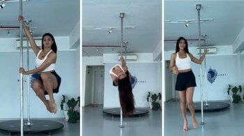 Jacqueline Fernandez, dressed in a white top and black skirt, made her exercise routine look easy, though it is no mean feat to get on the pole and move the way she did. It requires great body strength and focus, and she seems to have cracked the code (Screengrabs: @jacquelienefernandez/Instagram)