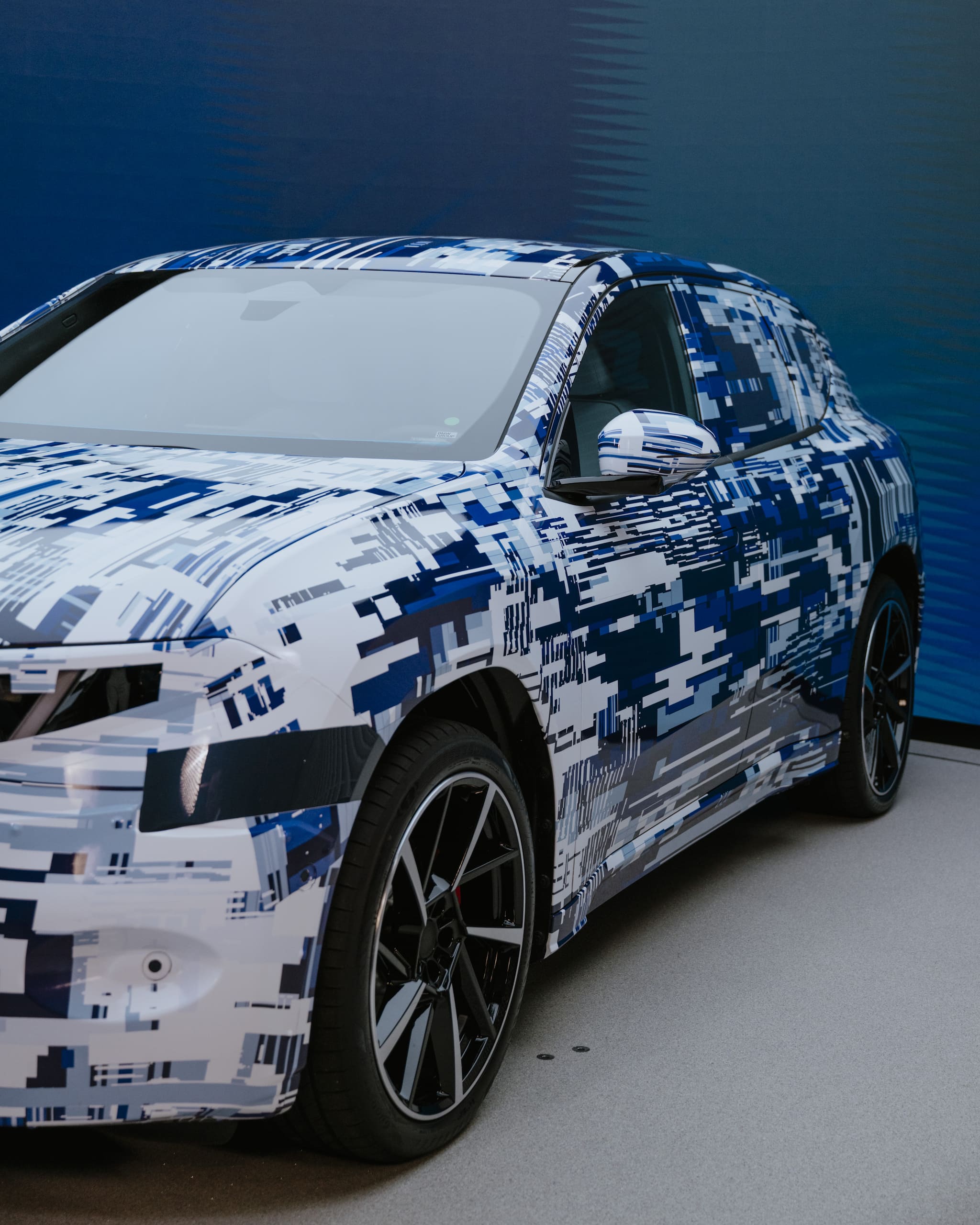 BMW strikes back at Tesla with longer-range EVs