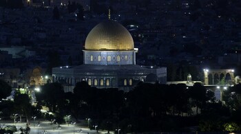 This picture taken from the Mount of Olives shows the Dome inside the al-Aqsa mosque compound in Jerusalem, at sunset on June 14, 2025. 
