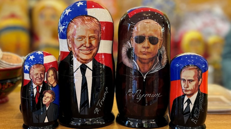 Traditional Russian wooden nesting dolls, Matryoshka dolls, depicting Russia's President Vladimir Putin and US President Donald Trump are displayed for sale at a gift shop on the touristic Arbat street in downtown Moscow on March 19, 2025.