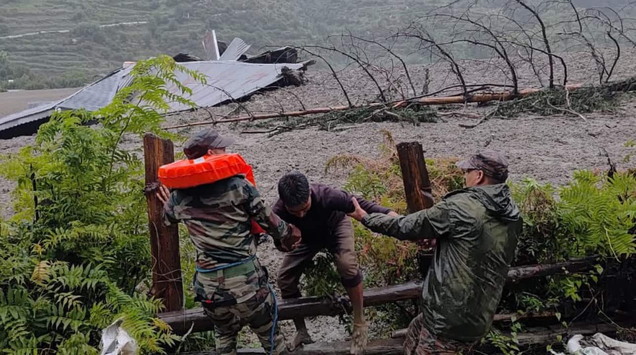 Indian Army personnel engaged in rescue operations after a landslide occurred near Dharali village, approximately 4 km from the Indian Army Camp at Harshil, at around 1:45 PM today. So far, 15–20 individuals have been successfully evacuated, with the injured receiving prompt medical treatment at the Indian Army medical facility in Harshil. Search and rescue efforts are ongoing. (Image: Indian Army)
