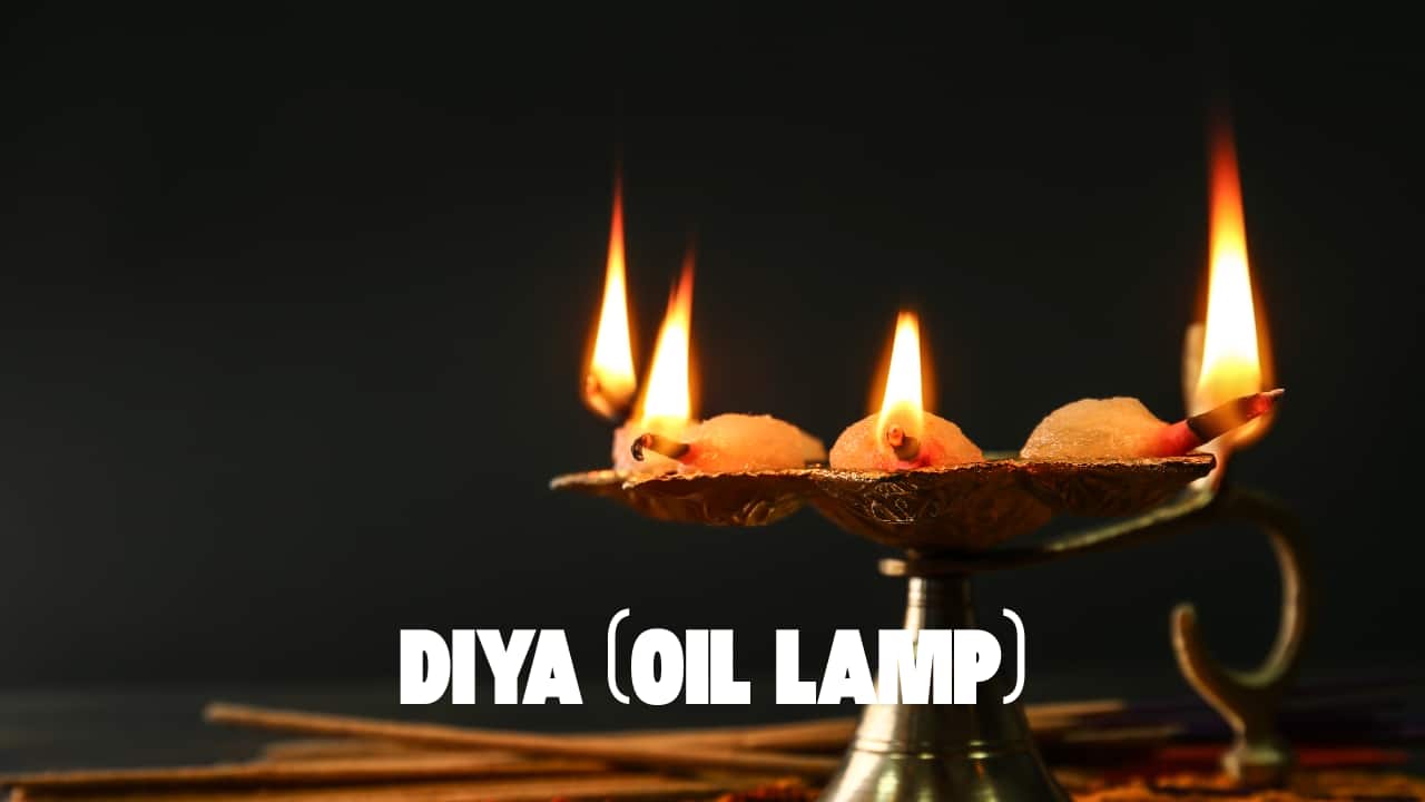 A lit diya spreads light and positivity. It is offered to the deities and waved around the brother as part of the aarti ritual. (image: canva)