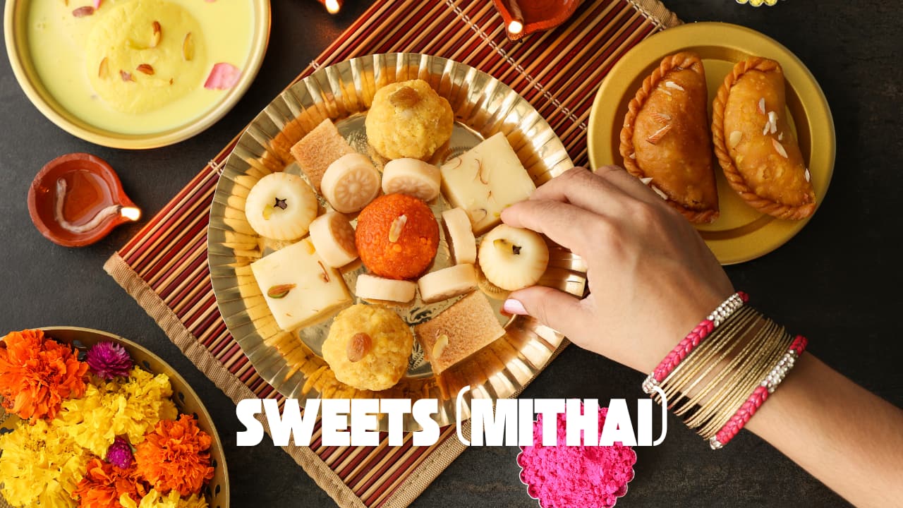 Sweets like laddoos or barfis are fed to the brother after tying Rakhi, signifying the sweetness and joy in your sibling bond. (image: canva)